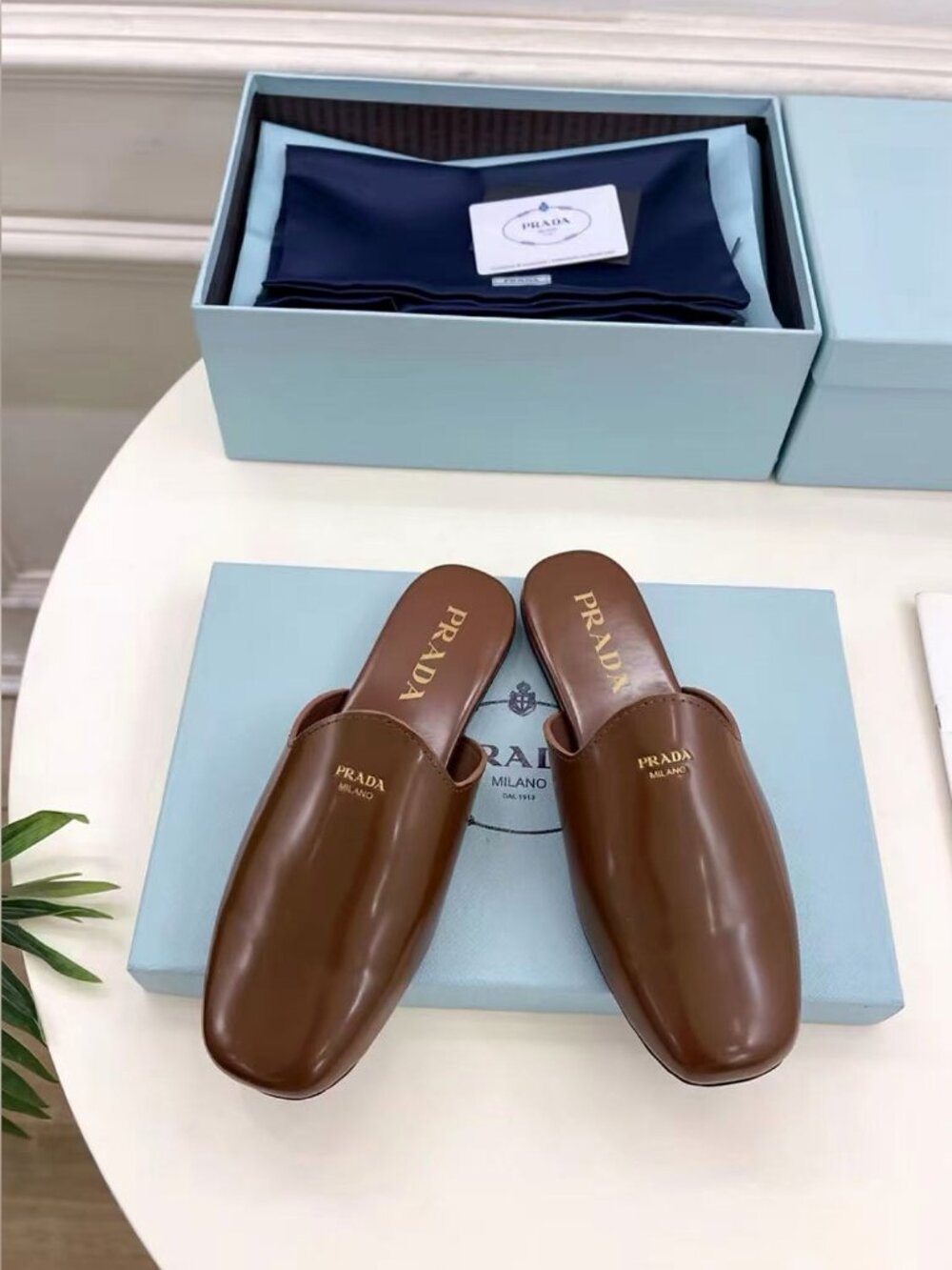 Prada Minimal Brown Polished Leather Gold Plaque Square Toe Mule Slides